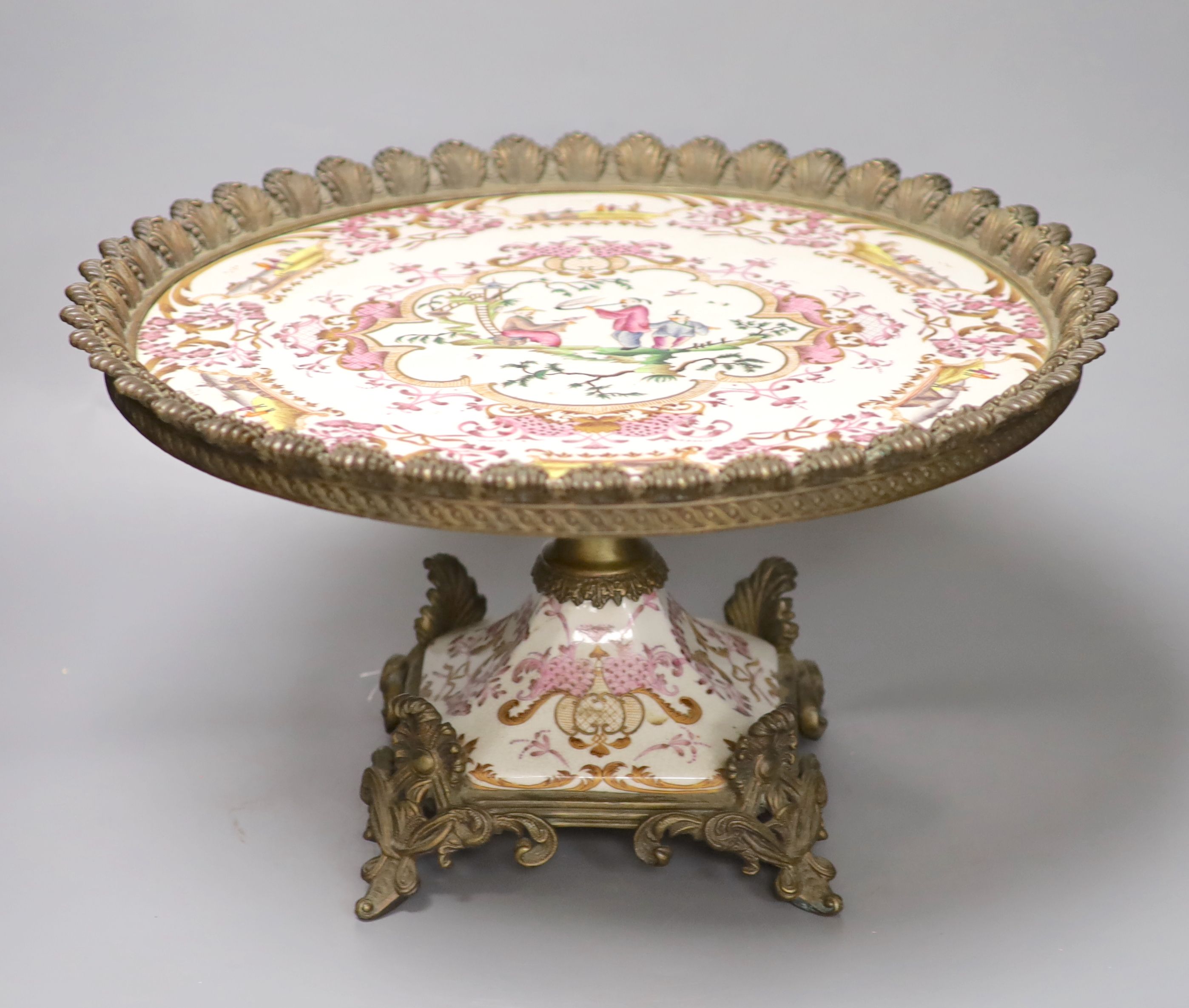 A Continental gilt metal mounted porcelain tazza, diameter 42.5cm height 24cm